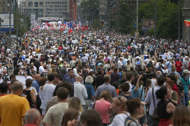 Tens of thousands of Russians flooded Moscow's tree-lined boulevards today
