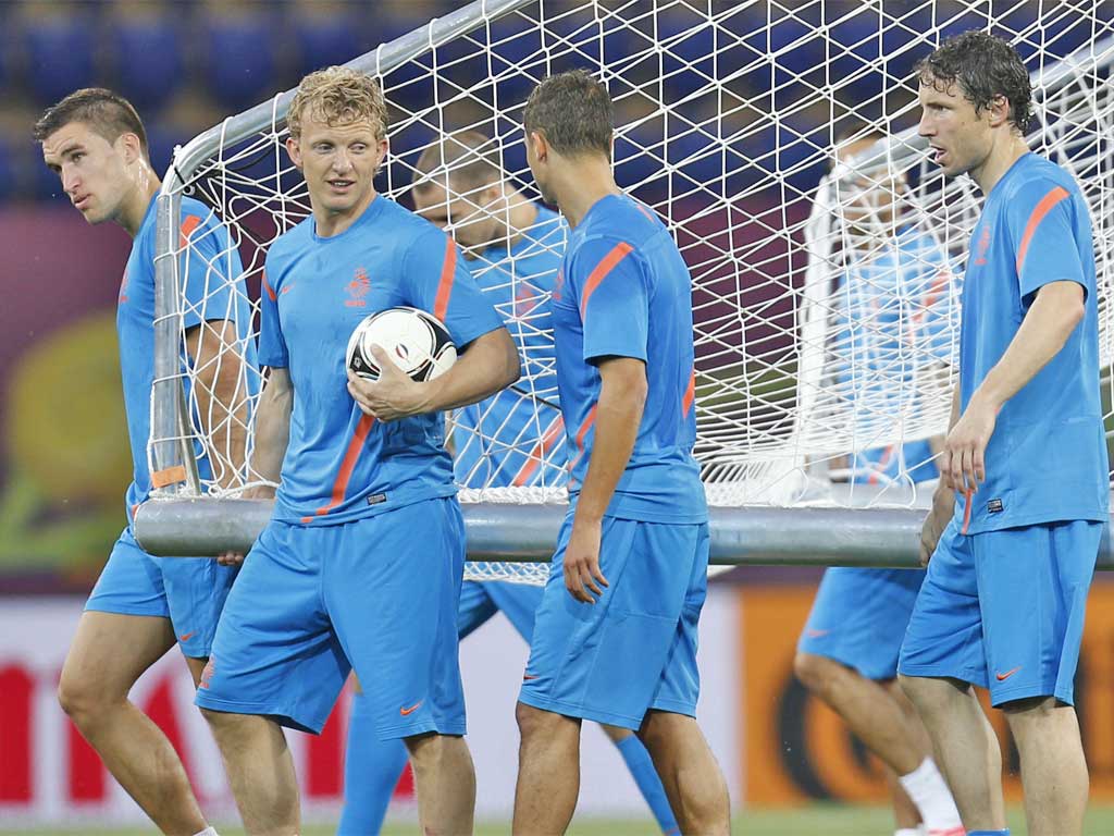 The Dutch players including Dirk Kuyt (with ball) and Marc van Bommel at training yesterday