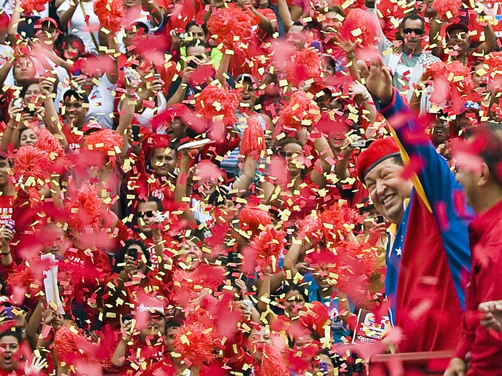 Venezuelan President Hugo Chavez waves to supporters