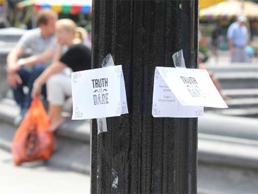 Two of the 'truth or dare' posters that were put up in Washington Square park