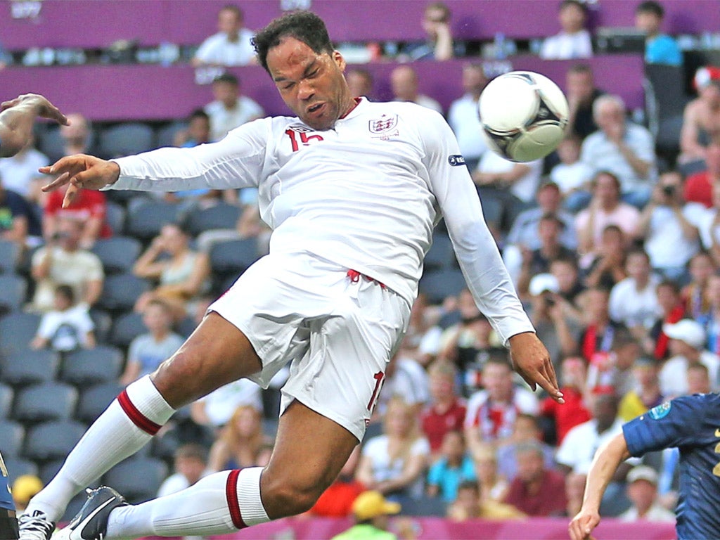 Way to get ahead: Lescott rises to score against France