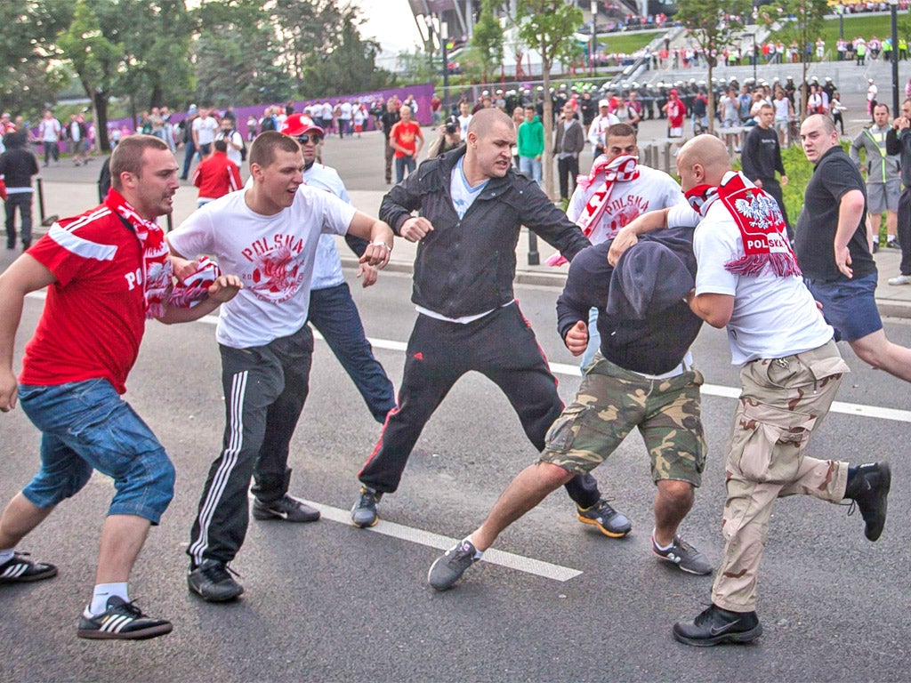 Russian fans clash with their Polish rivals in Warsaw on Tuesday night