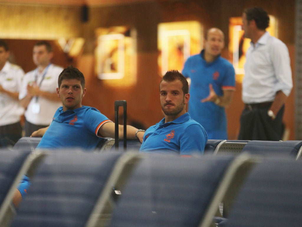 Klaas-Jan Huntelaar and Rafael van der Vaart wait for a flight following Germany defeat