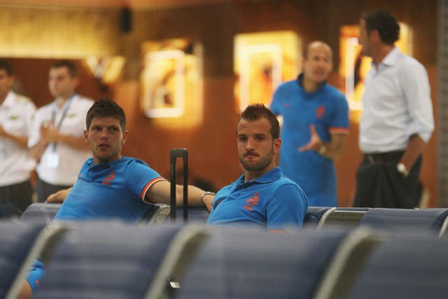 Klaas-Jan Huntelaar and Rafael van der Vaart wait for a flight following Germany defeat