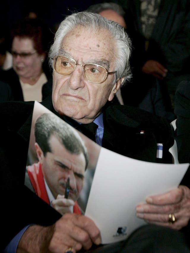 Tueni with a picture of his son Gebran, who was killed by a bomb blast