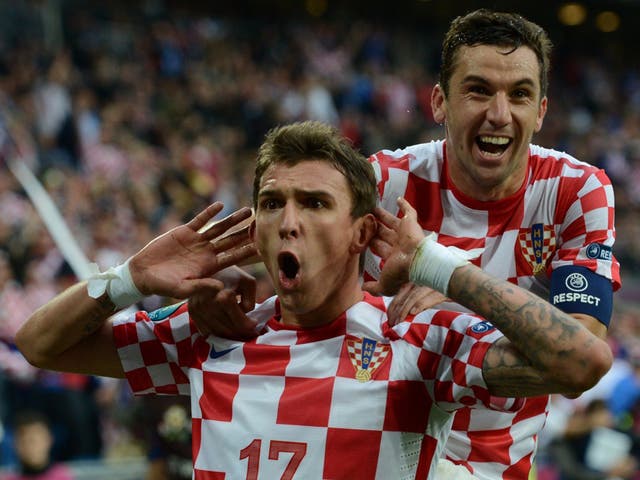 Mario Mandzukic (left) is congratulated after scoring Croatia's equaliser