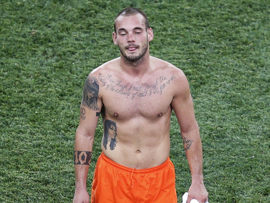 Wesley Sneijder leaves the pitch after the defeat by Germany