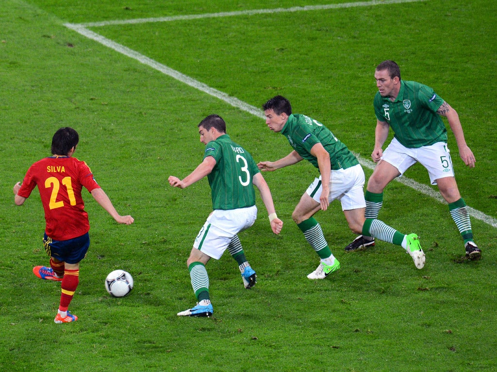 David Silva (left) outfoxes
the Ireland defence to score
Spain's second last night