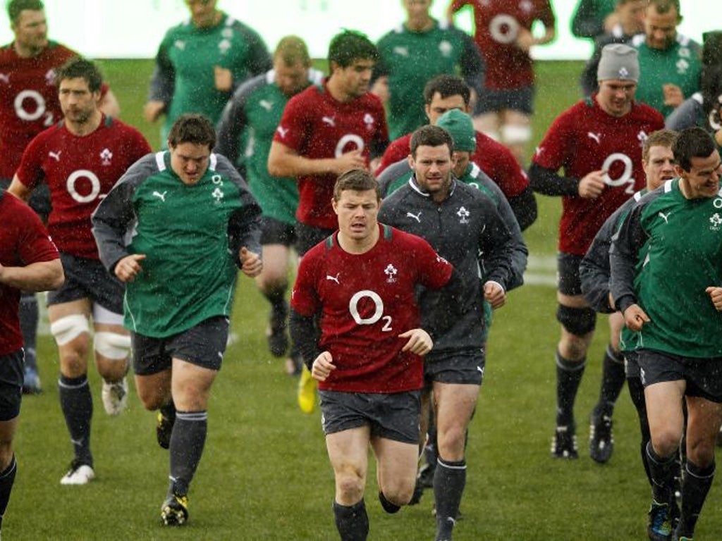 Brian O'Driscoll leads the Irish team in training yesterday