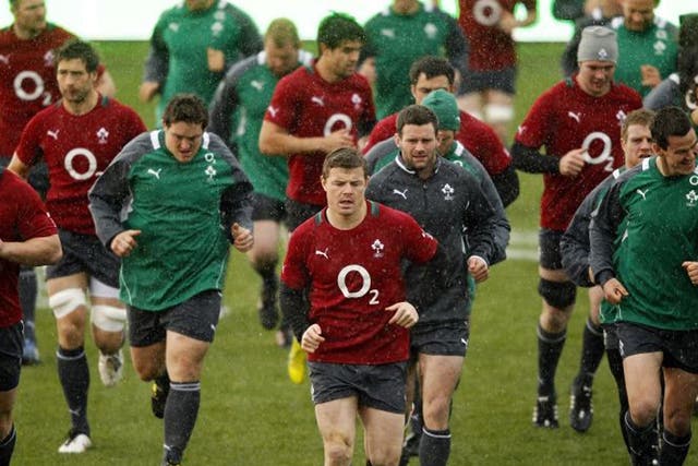 Brian O'Driscoll leads the Irish team in training yesterday