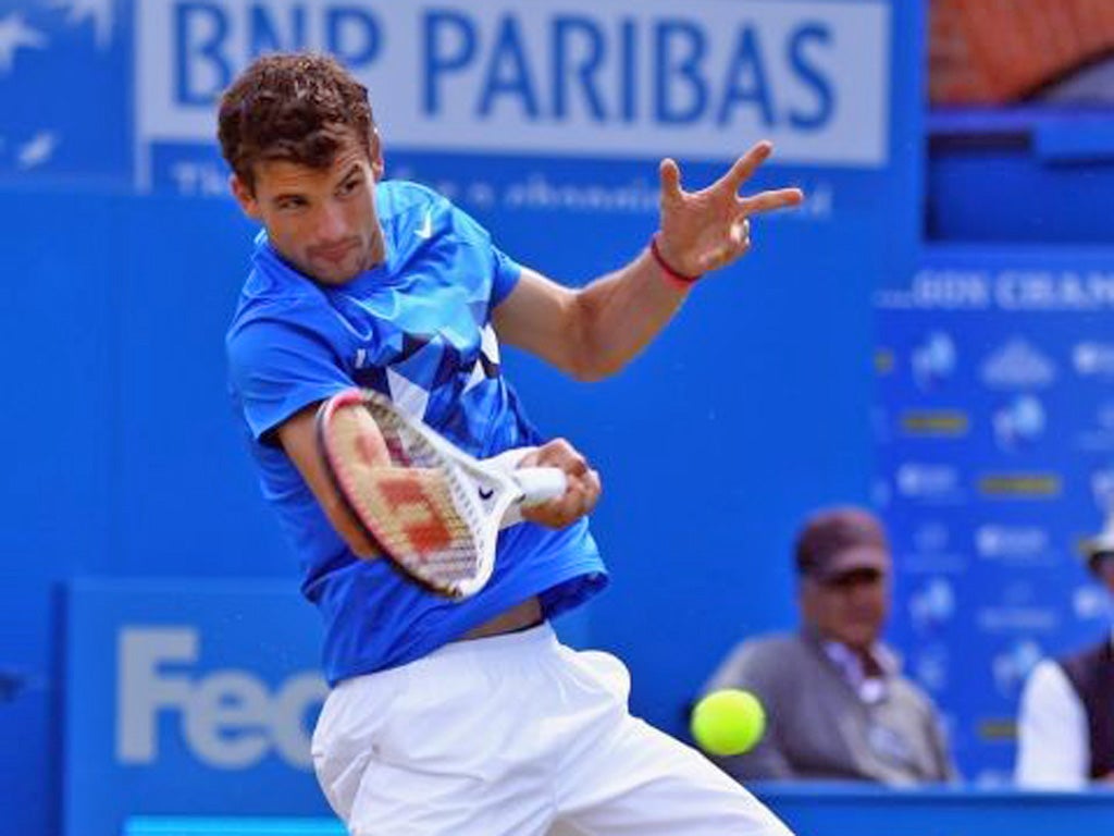 Grigor Dimitrov hits a forehand return to Kevin Anderson yesterday