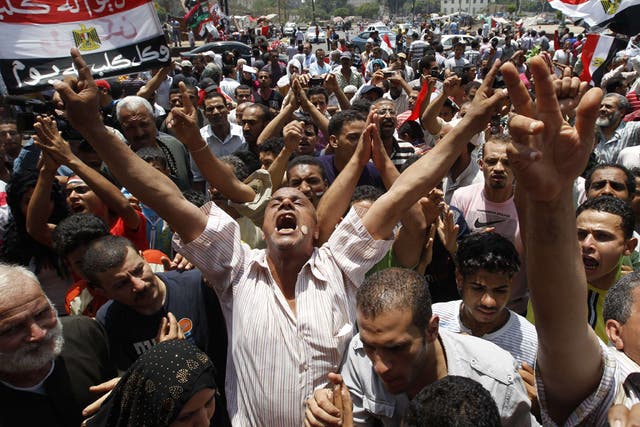 Protesters in Cairo's Tahrir Square shout slogans against the Egyptian military council after Friday prayers yesterday