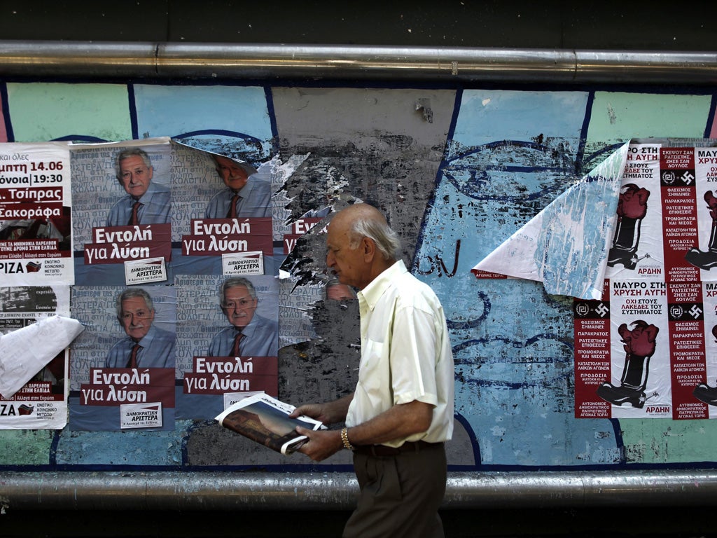 The campaign posters signal election time in Greece