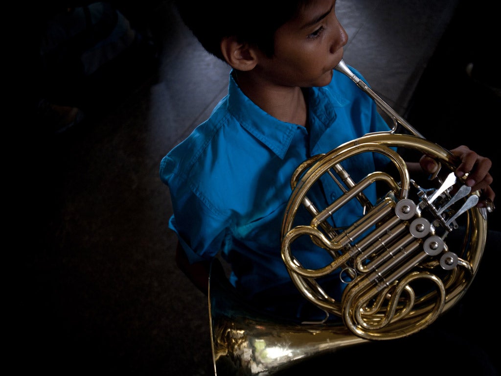 A member of Venezuela's Simon Bolivar Youth Symphonic Orchestra plays during a free concert directed by Gustavo Dudamel