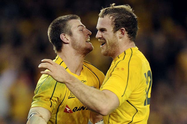 Home heroes: Rob Horne (left) celebrates with Pat McCabe