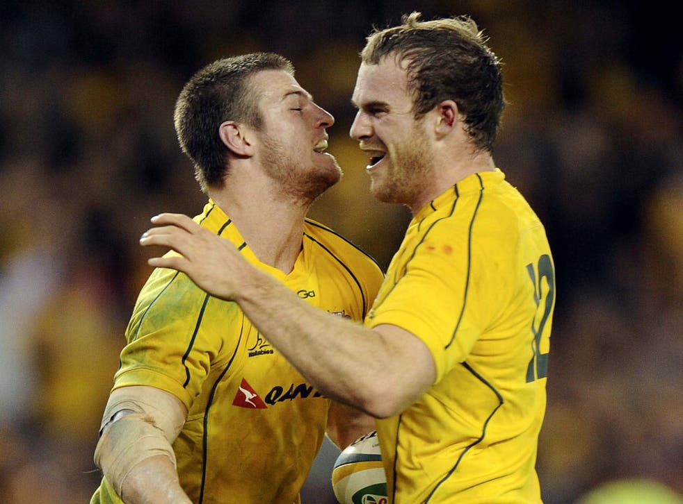 Home heroes: Rob Horne (left) celebrates with Pat McCabe