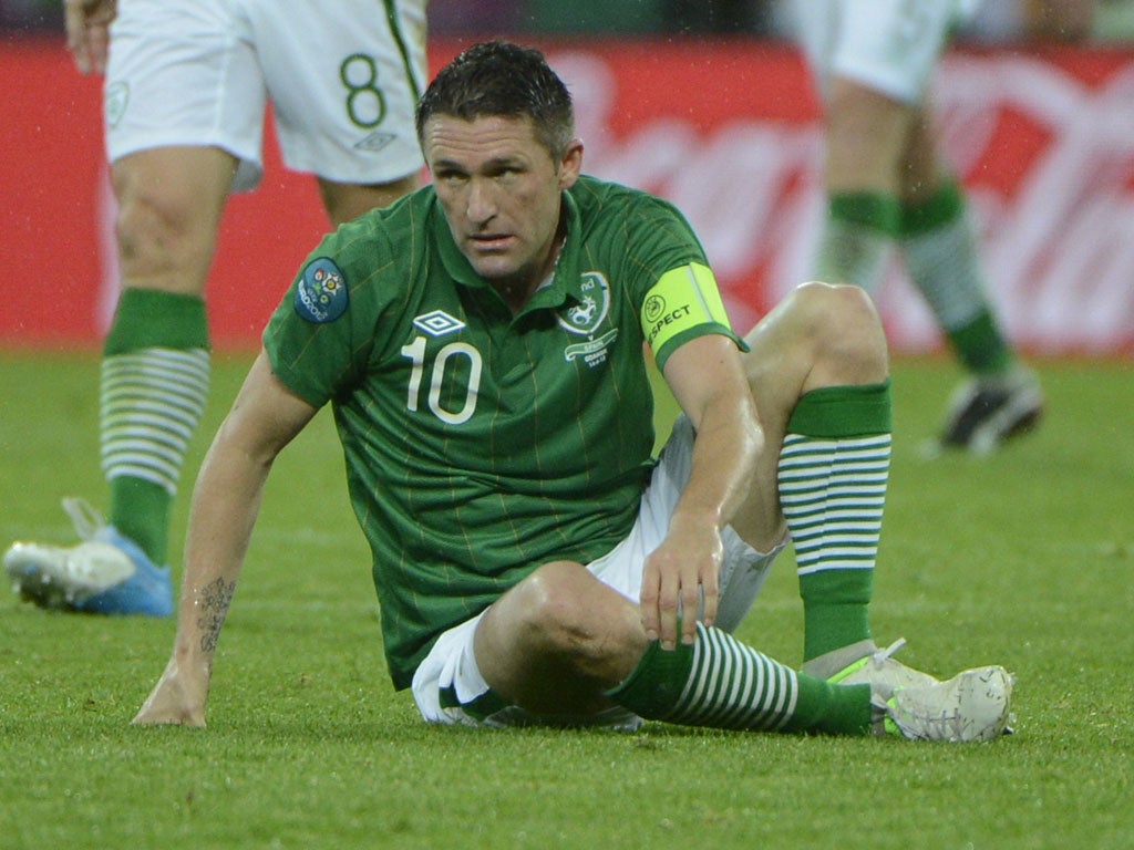 Robbie Keane is down and out against Spain