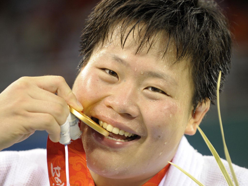Judo player Tong Wen with the medal she won in 2008