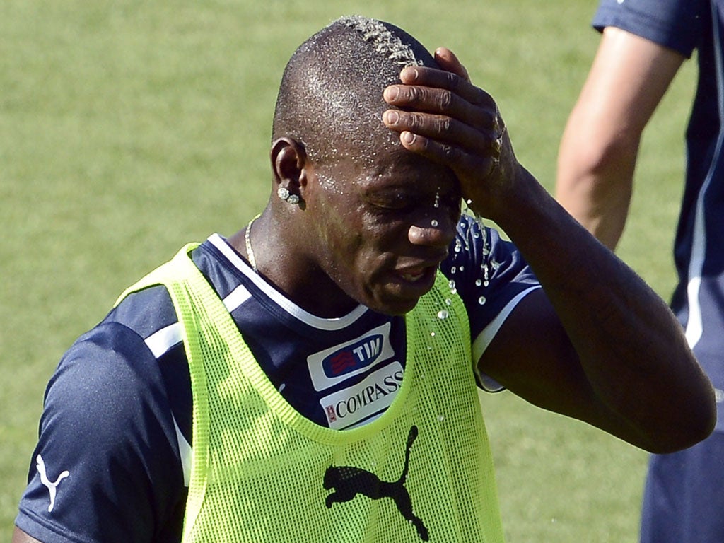 Headache: Mario Balotelli has been subjected to abuse from rival fans