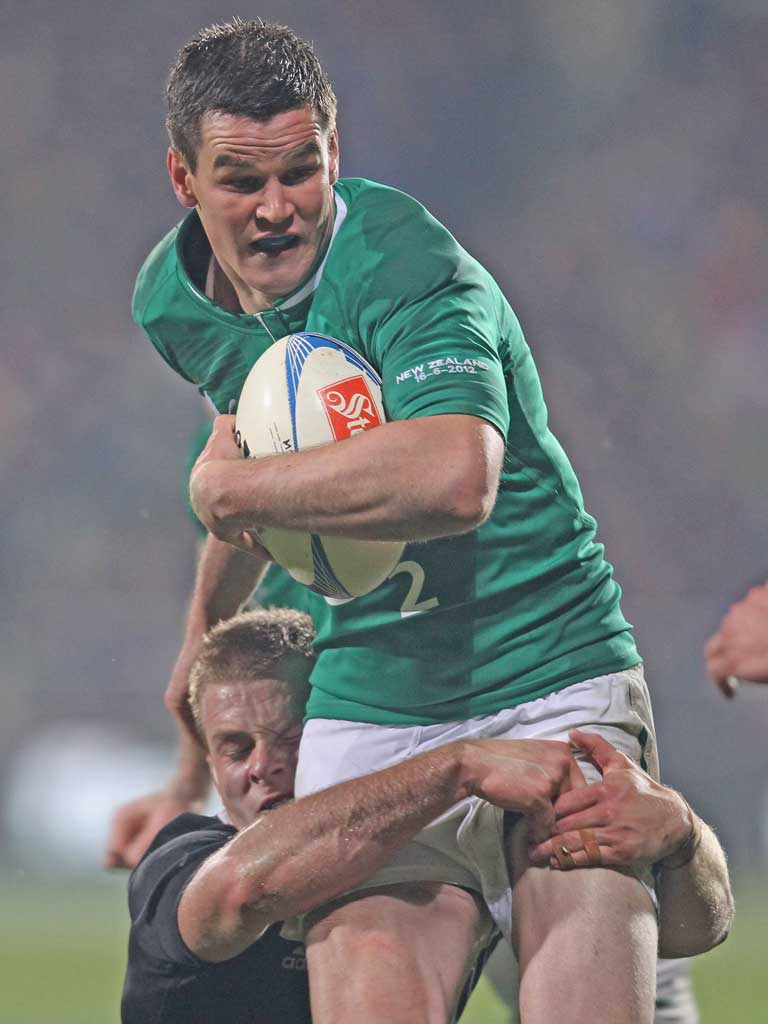 Jonathan Sexton is tackled by Sam Cane in Christchurch