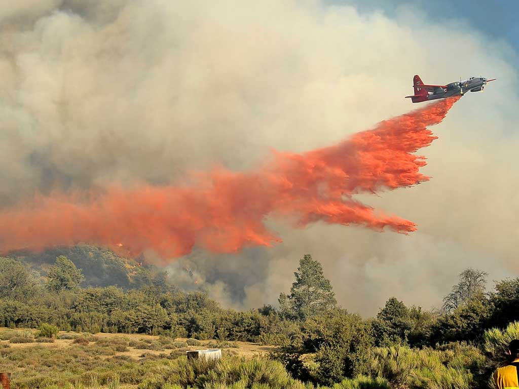 An air tanker drops fire retardant on a brush fire at the Los Padres National Forest in California