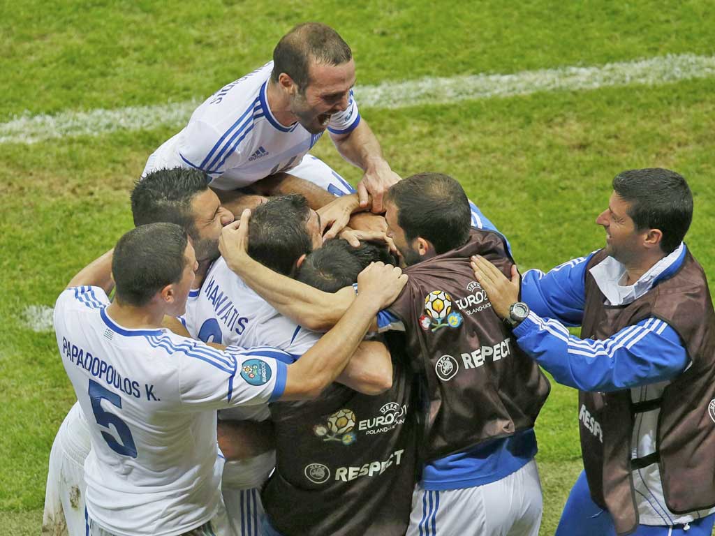 Greece players celebrate their shock win over Russia on Saturday