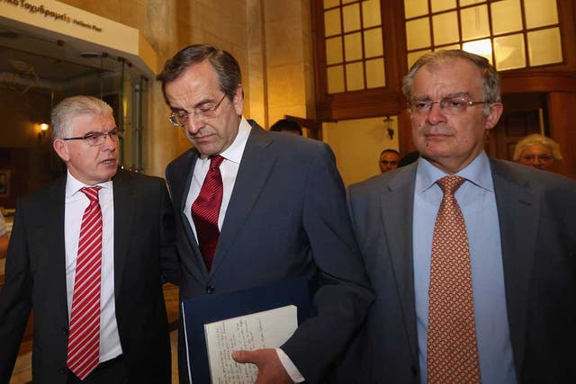 Antonis Samaras (centre) launched coalition talks today