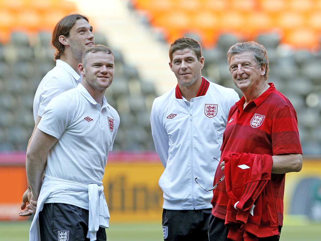 England manager Roy Hodgson with (from left) Andy Carroll,
Wayne Rooney and Steve Gerrard