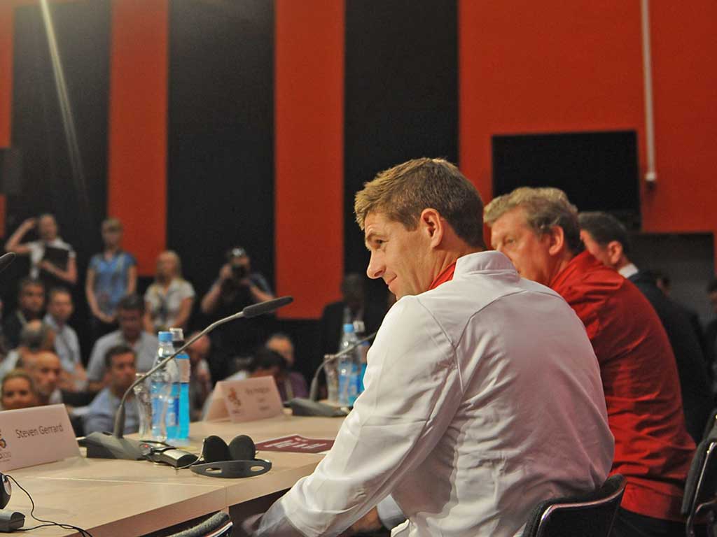 Steven Gerrard faces the media alongside England manager Roy
Hodgson in Donetsk last night