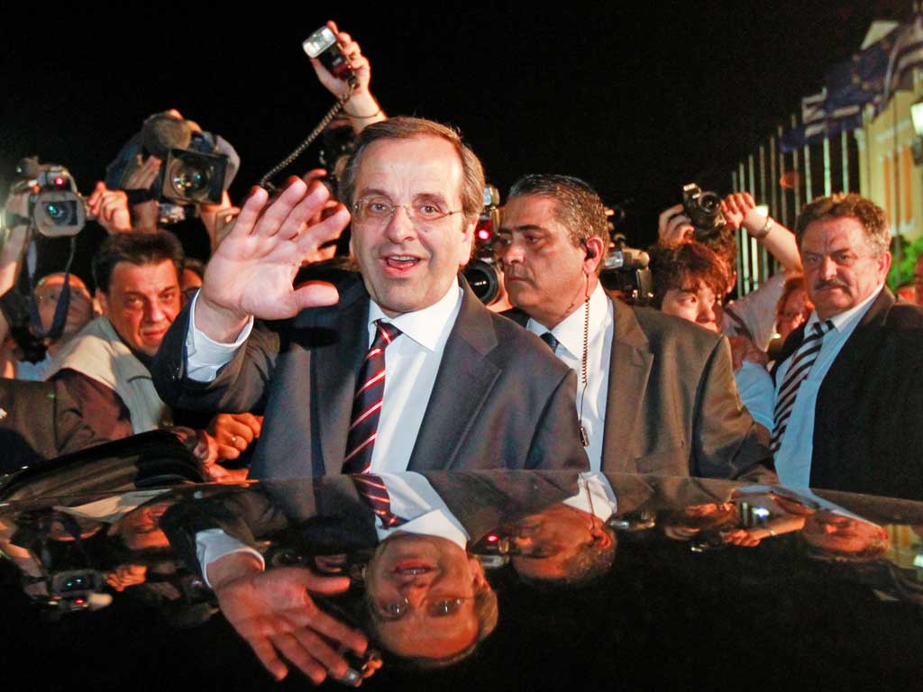 Antonis Samaras, leader of the New Democracy party, waves to supporters