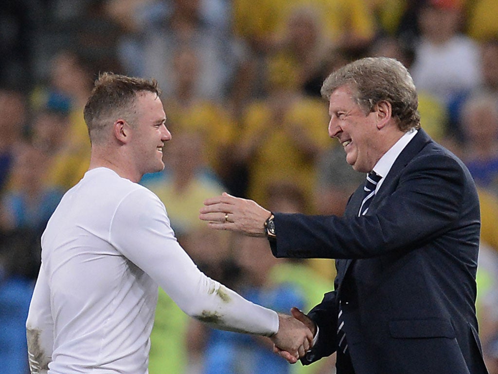 Roy Hodgson and Wayne Rooney at the final whistle against Ukraine
