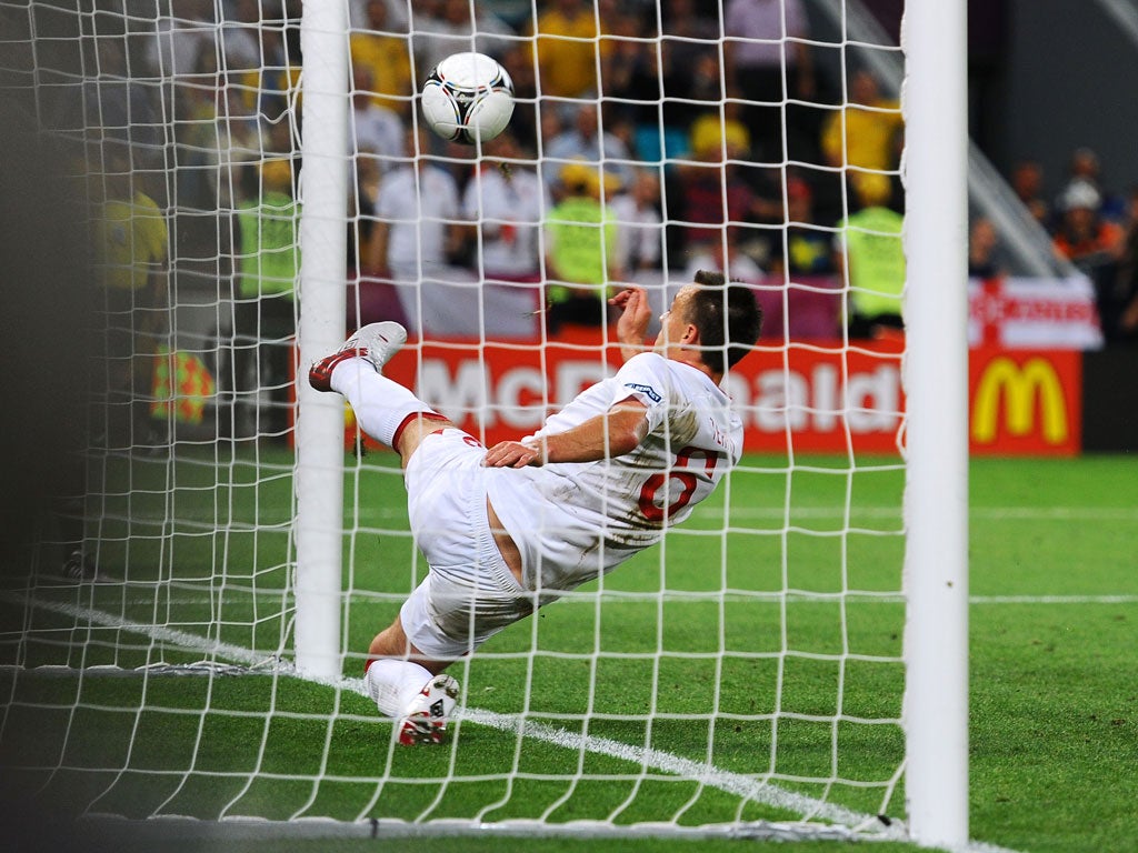 John Terry clears the ball awayat Euro 2012