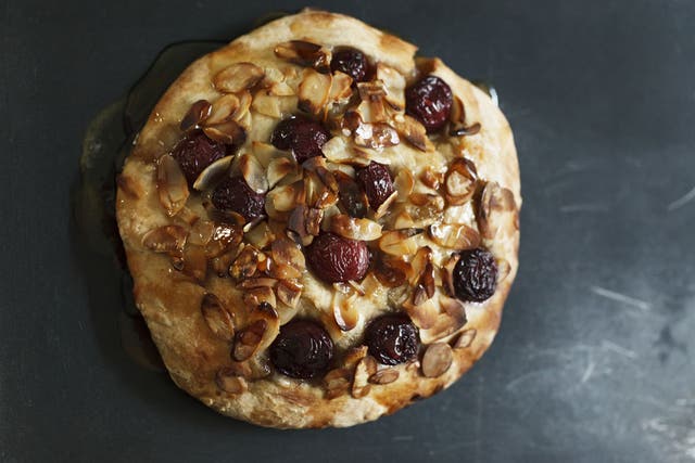 Focaccia with cherries, honey and almonds