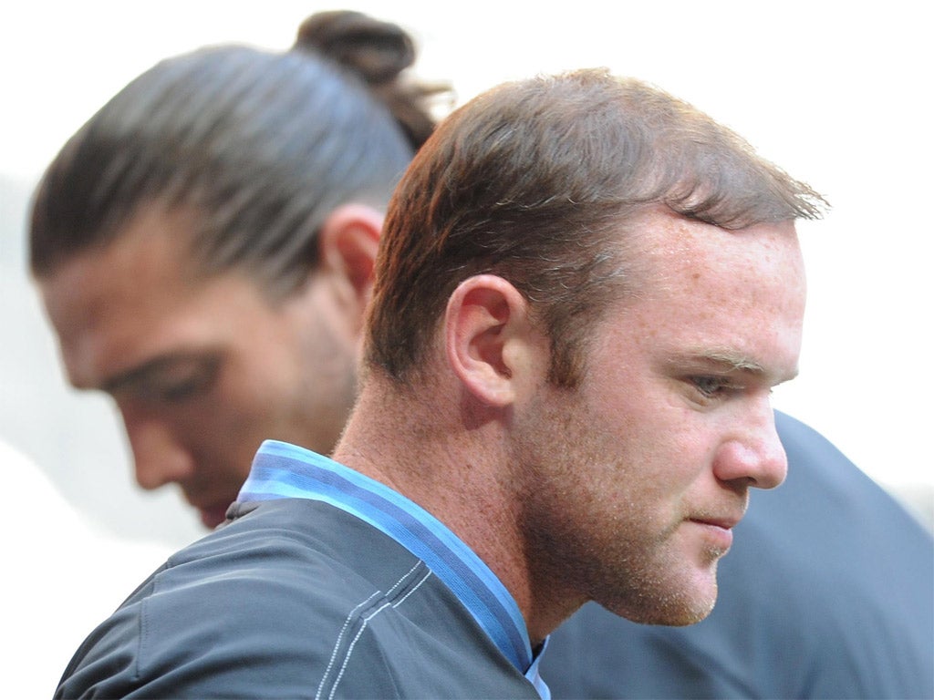 Gelling well: England strikers Wayne Rooney and Andy Carroll