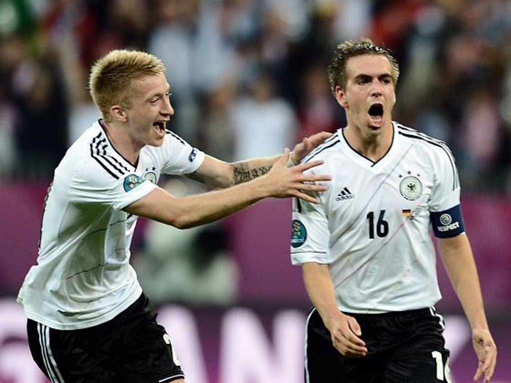 Philipp Lahm (right) celebrates scoring Germany's opener with
Marco Reus
