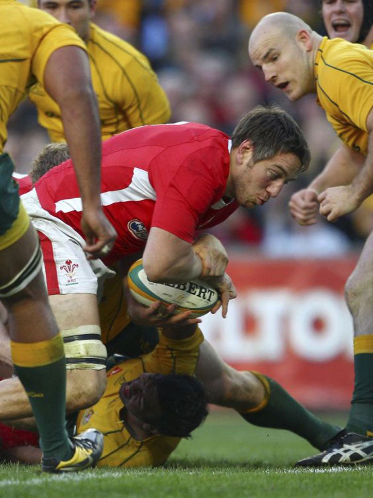 Wales' Ryan Jones drives to the line to score a try against Australia