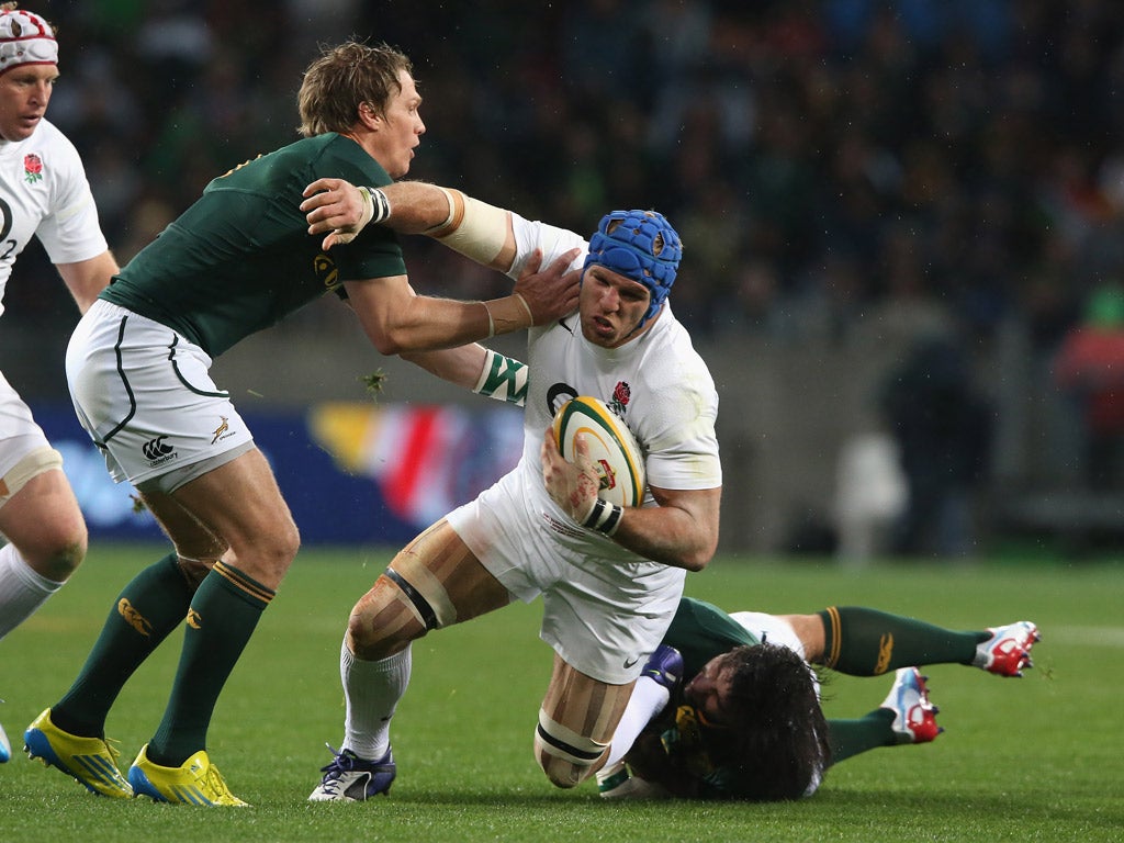 James Haskell is tackled by Jean de Villiers