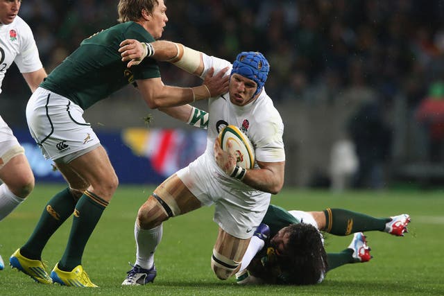 James Haskell is tackled by Jean de Villiers