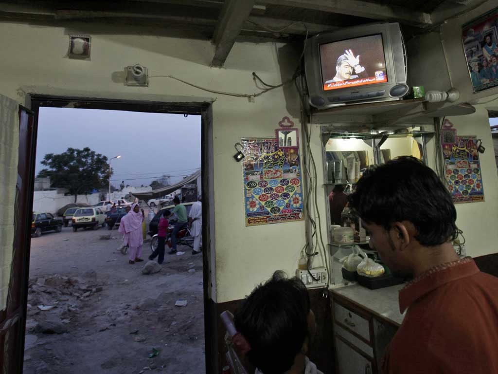 Off Screen: Yousaf Raza Gilani (on TV) was sacked as Pakistan's PM last week