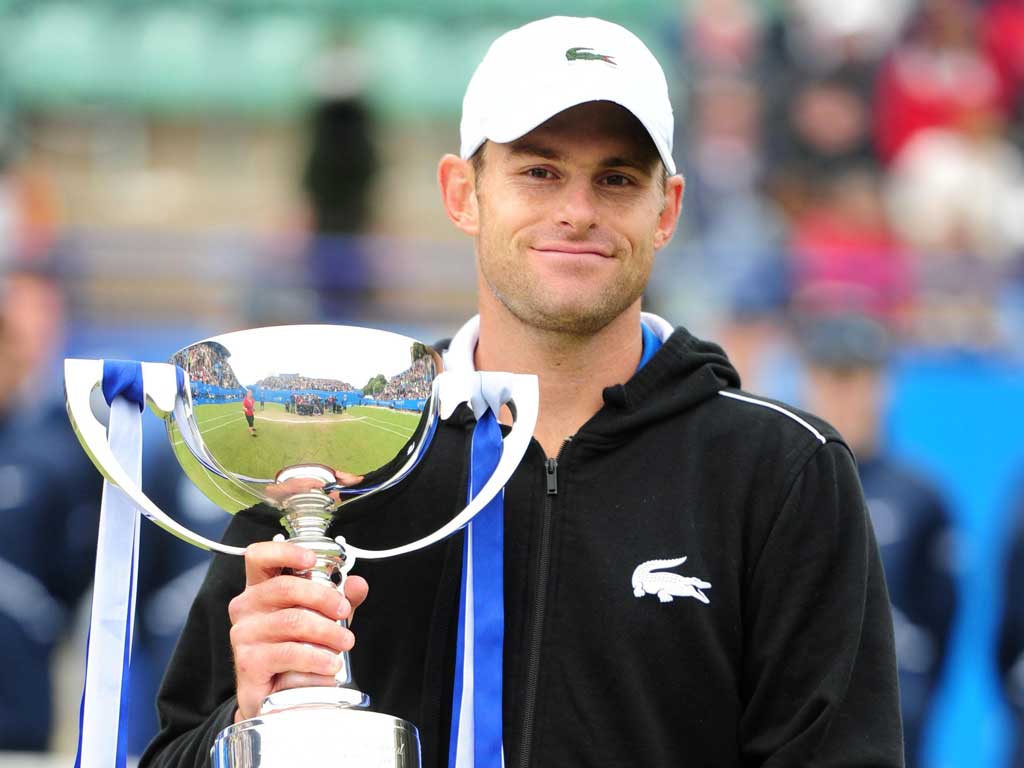 Prize guy: Andy Roddick claims his
trophy in Eastbourne