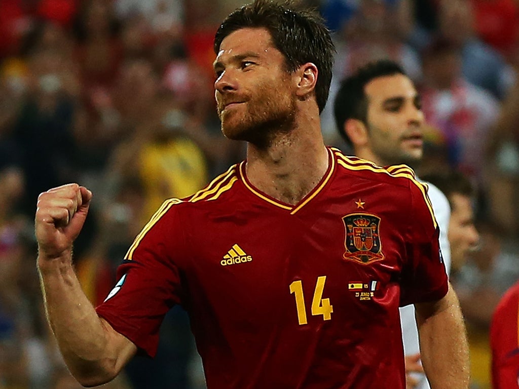 Xabi Alonso of Spain celebrates after scoring the second goal from the penalty spot during the UEFA EURO 2012 quarter final