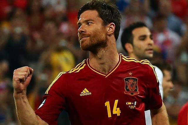 Xabi Alonso of Spain celebrates after scoring the second goal from the penalty spot during the UEFA EURO 2012 quarter final 