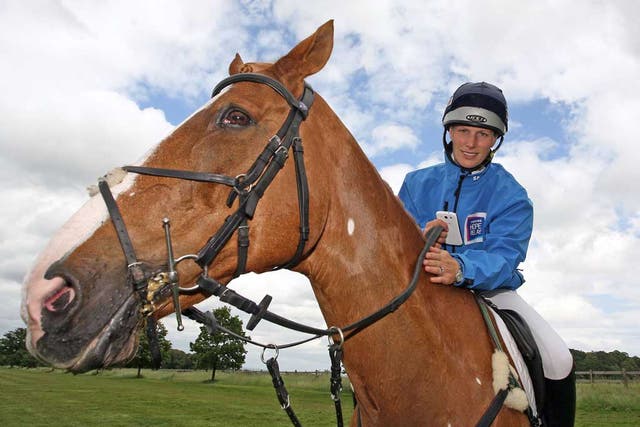 Zara Phillips, phone in hand, on Toytown, who won’t be joining her at the Olympics