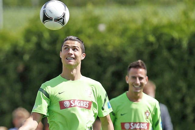 Joao Pereira (right) keeps an eye on Cristiano Ronaldo during Portugal training