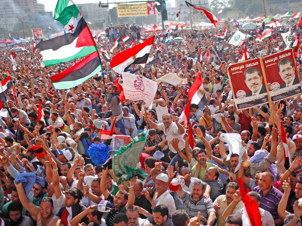 Supporters of the Muslim Brotherhood’s candidate Mohamed
Morsi celebrating his victory in Tahrir Square yesterday
