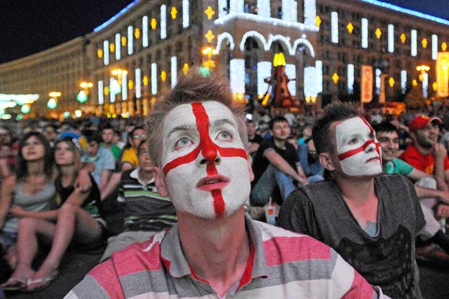 England supporters watch the drama unfold in Kiev’s fan zone last
night