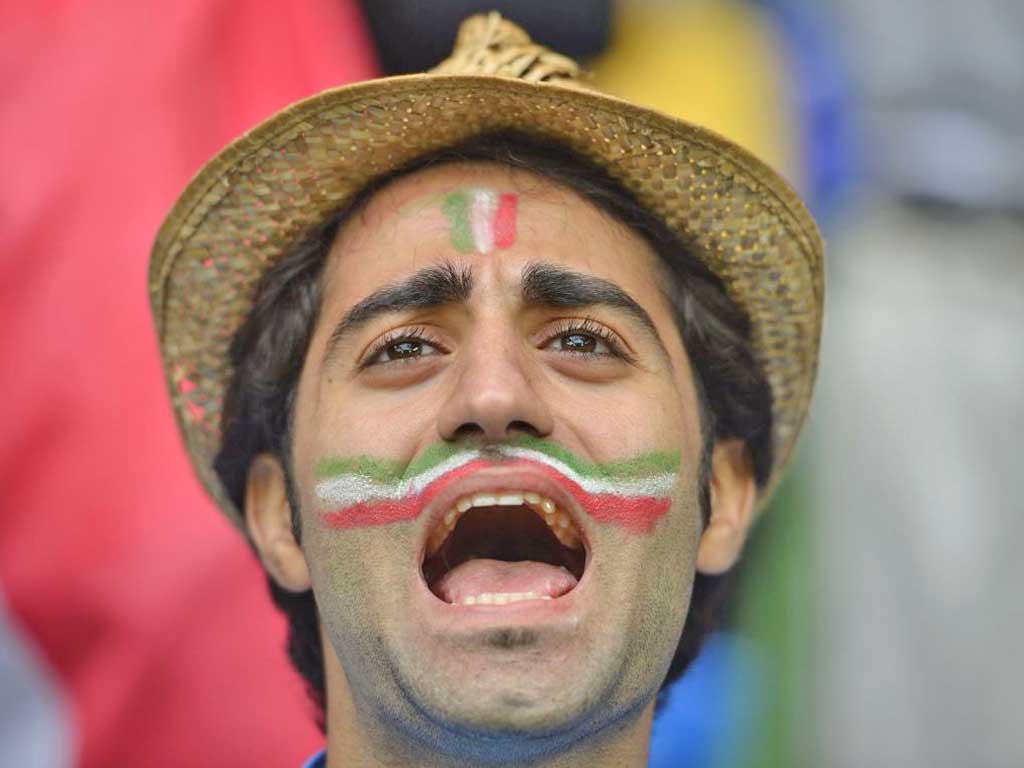 An Italian fan shows that face paint can be chic