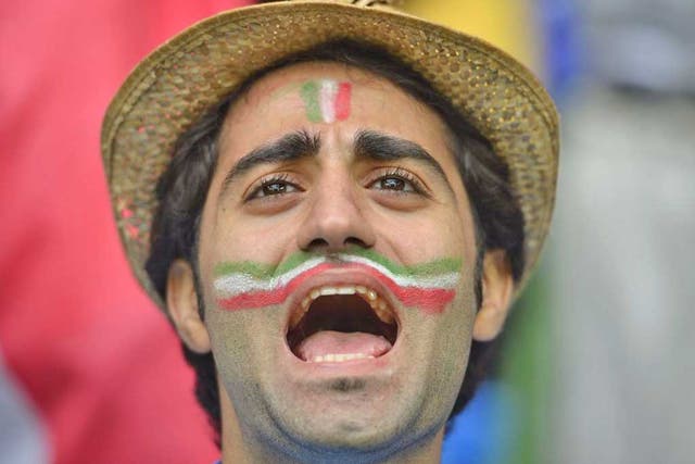 An Italian fan shows that face paint can be chic