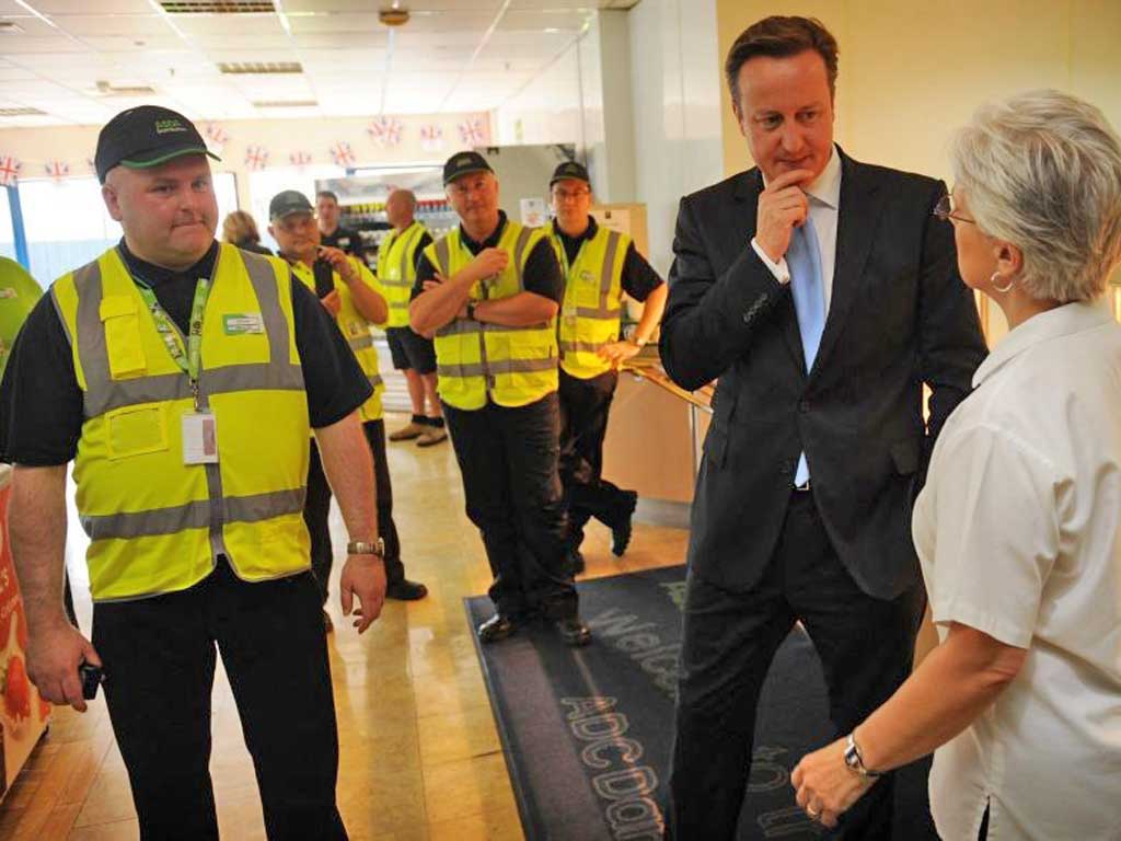 David Cameron meets workers at an Asda distribution centre in Dartford, Kent, yesterday