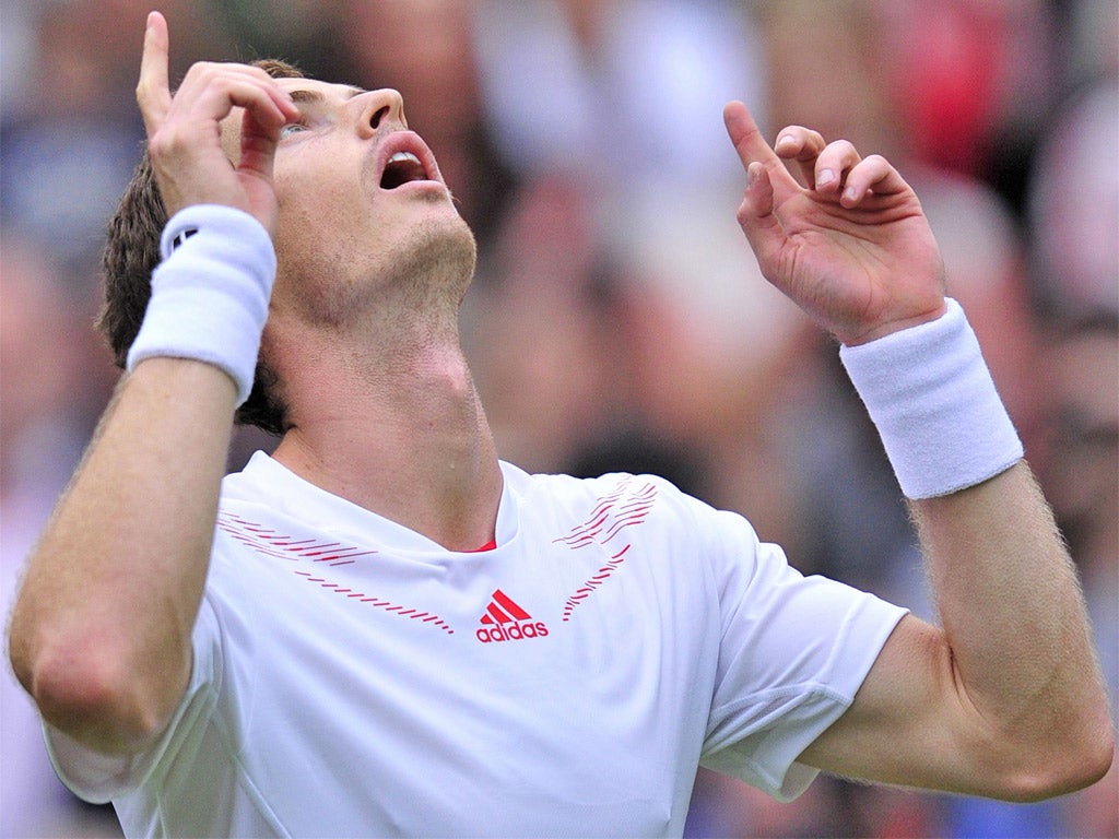 Andy Murray salutes the skies after his easy first-round victory